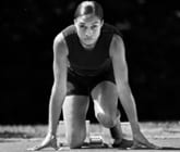 allyson felix kneeling before a run