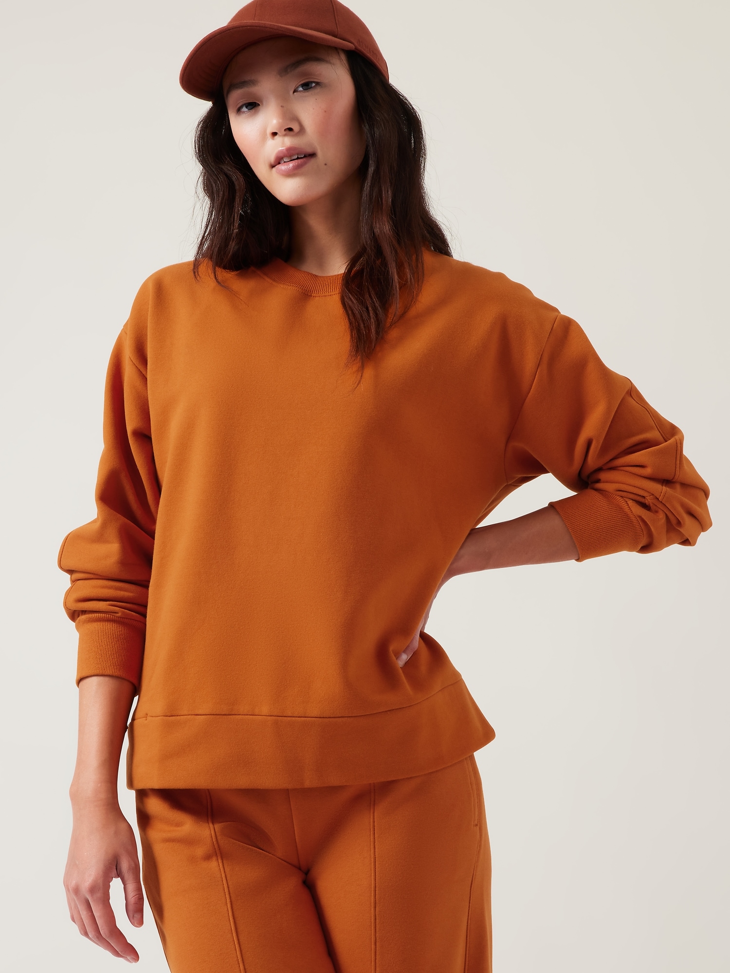 Athleta Retroplush Crewneck Sweatshirt orange. 1