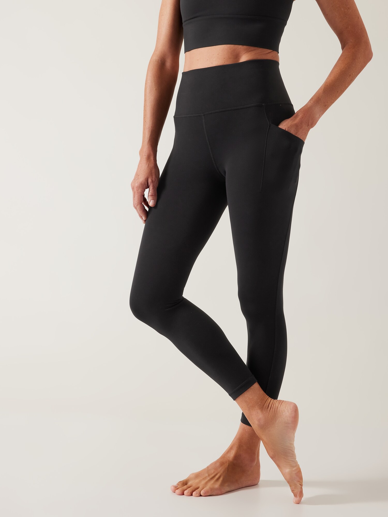 Athleta Salutation Stash High Rise 7/8 Legging black. 1