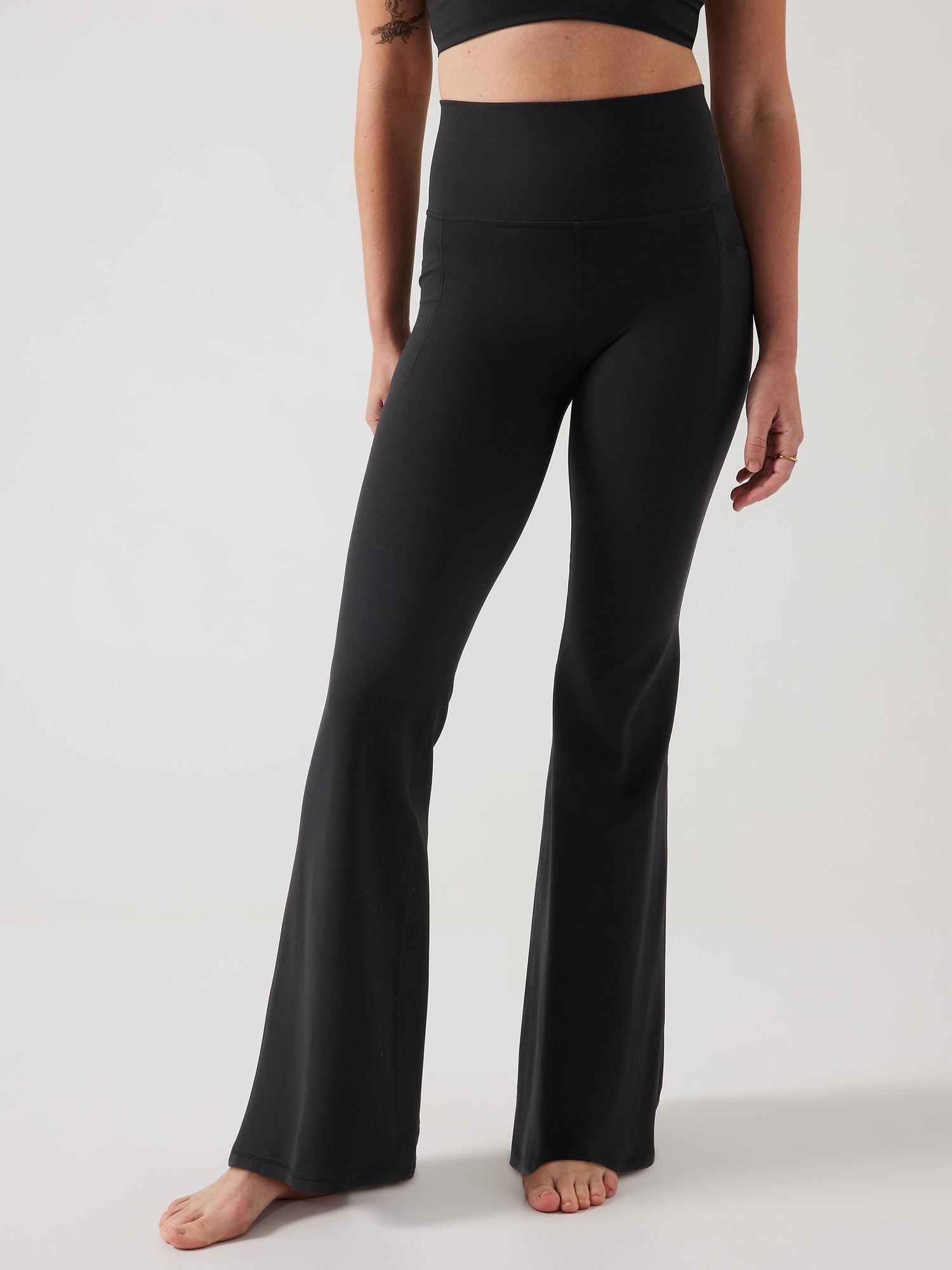 Athleta Salutation Stash High Rise Flare Pant black. 1