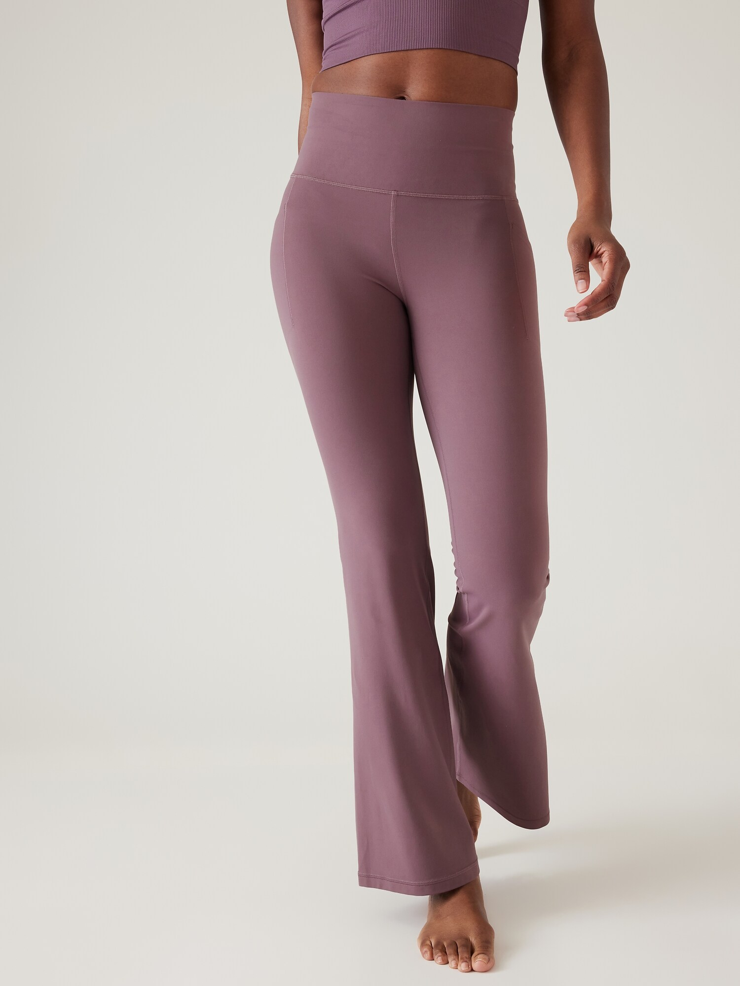 Athleta Salutation Stash Flare Pant pink. 1