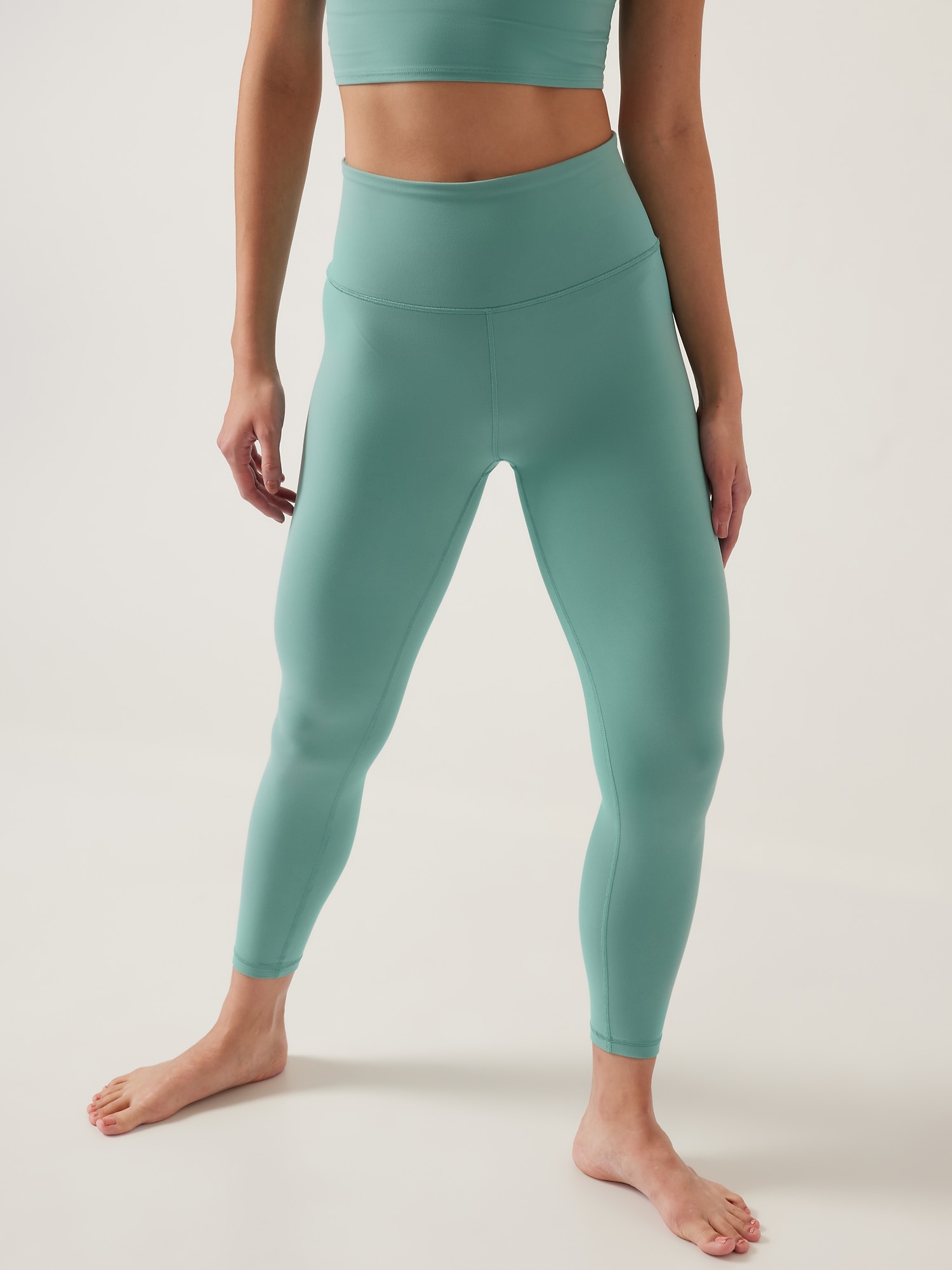 Athleta Ultra High Rise Elation 7/8 Tight green. 1