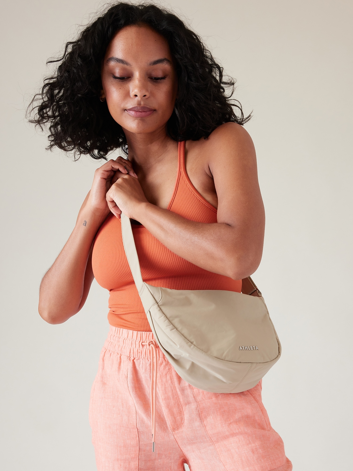 Athleta All About Crossbody Bag beige. 1