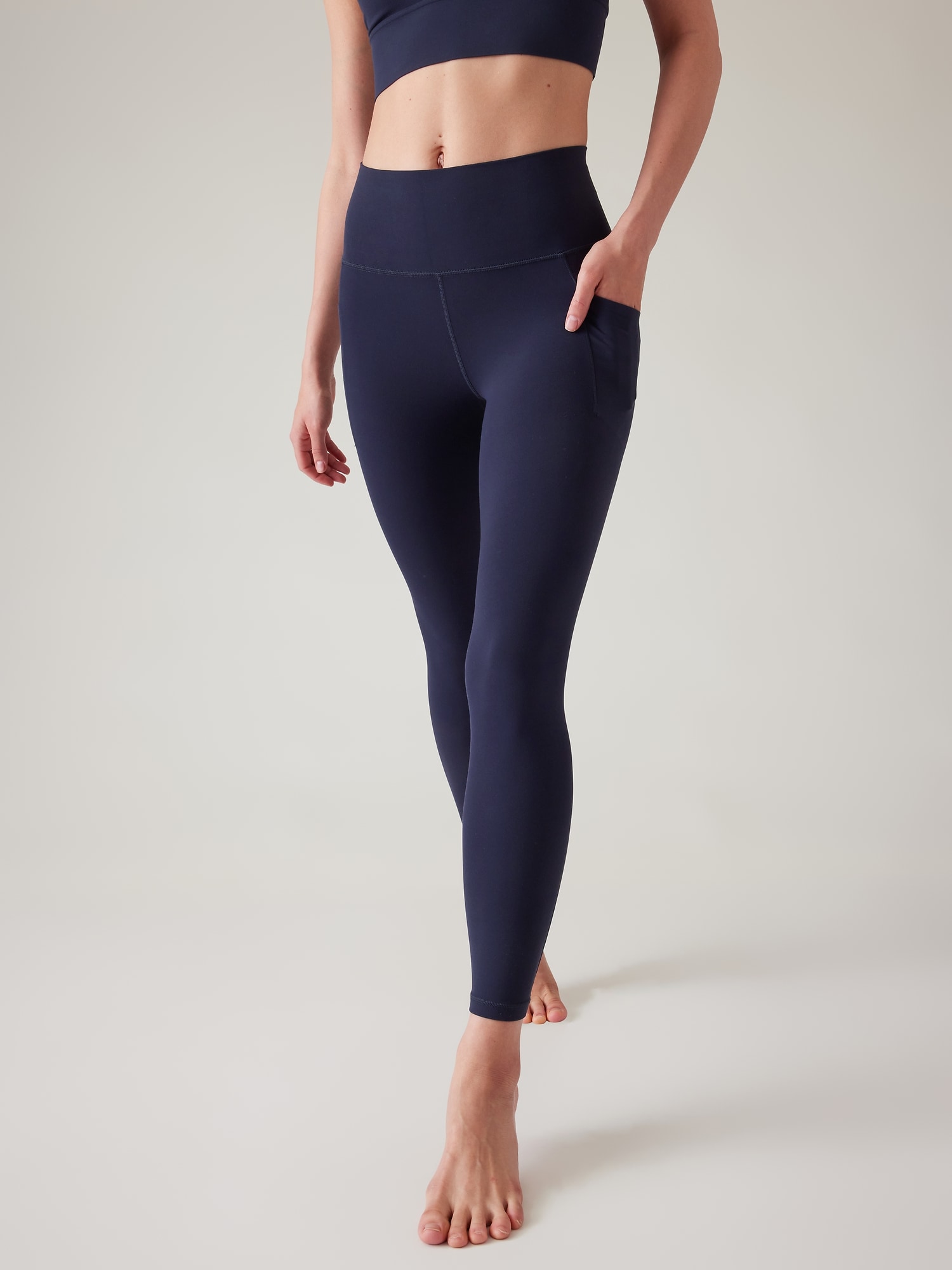 Athleta Salutation Stash High Rise 7/8 Legging blue. 1