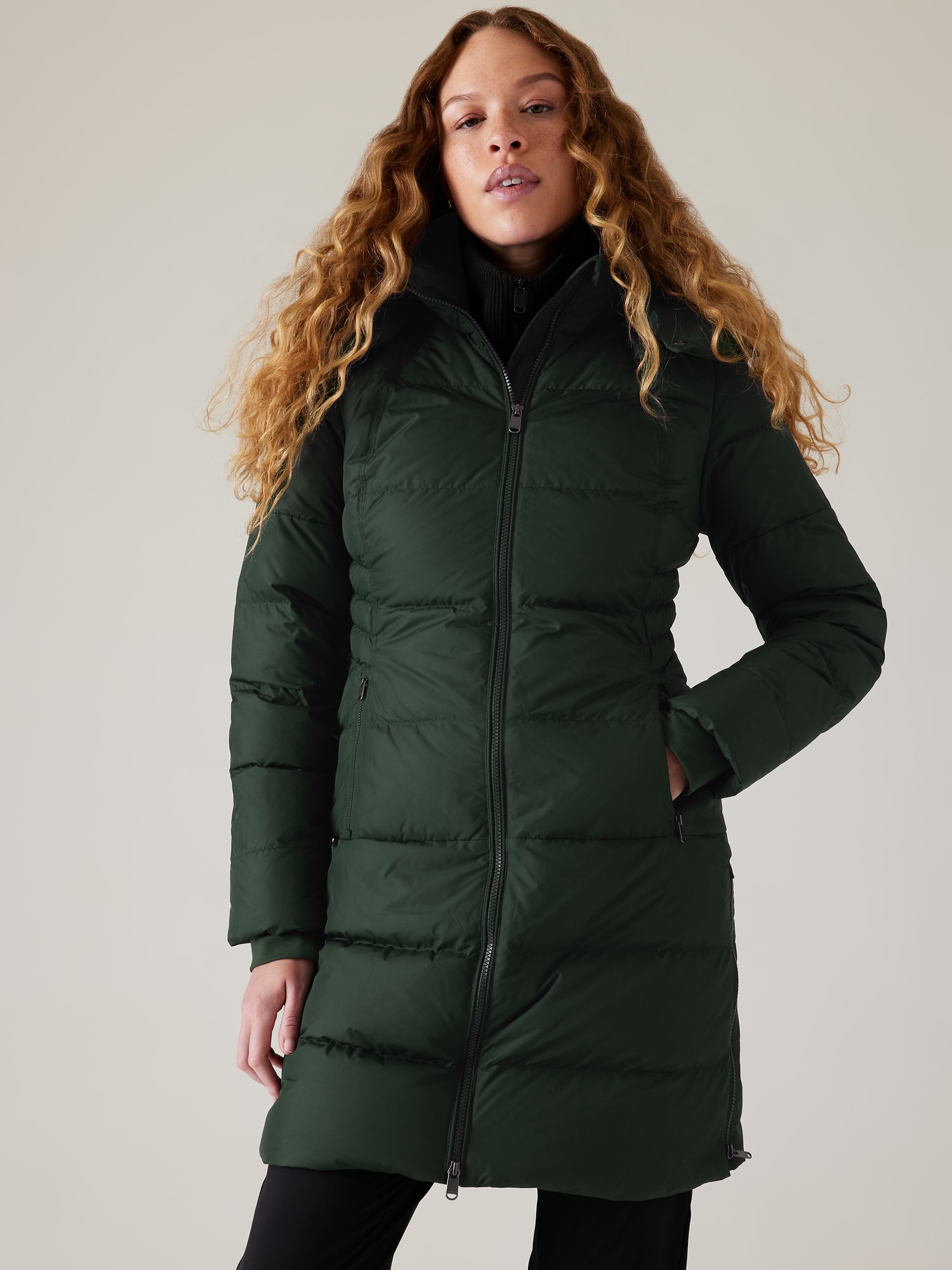 Classic parka coat has become wardrobe icon. Versatile functional and  stylish. Girl wear parka while walk park. Puffer jacket with hood. Woman  wear black parka fur hood. Youth hipster fashion concept Stock