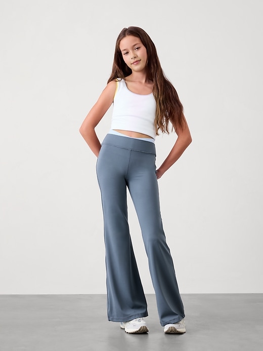 View large product image 1 of 3. Athleta Girl Transcend Crossover Ultra Flare Pant